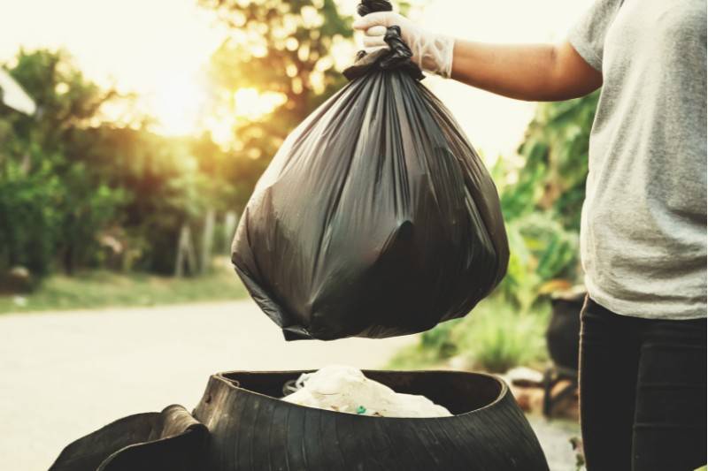 trash bag in recycling bin